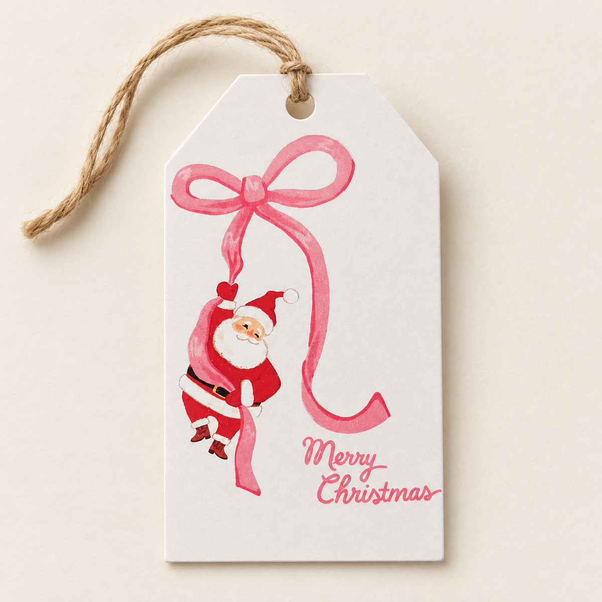 Merry Christmas swing tag with Santa and a pink bow