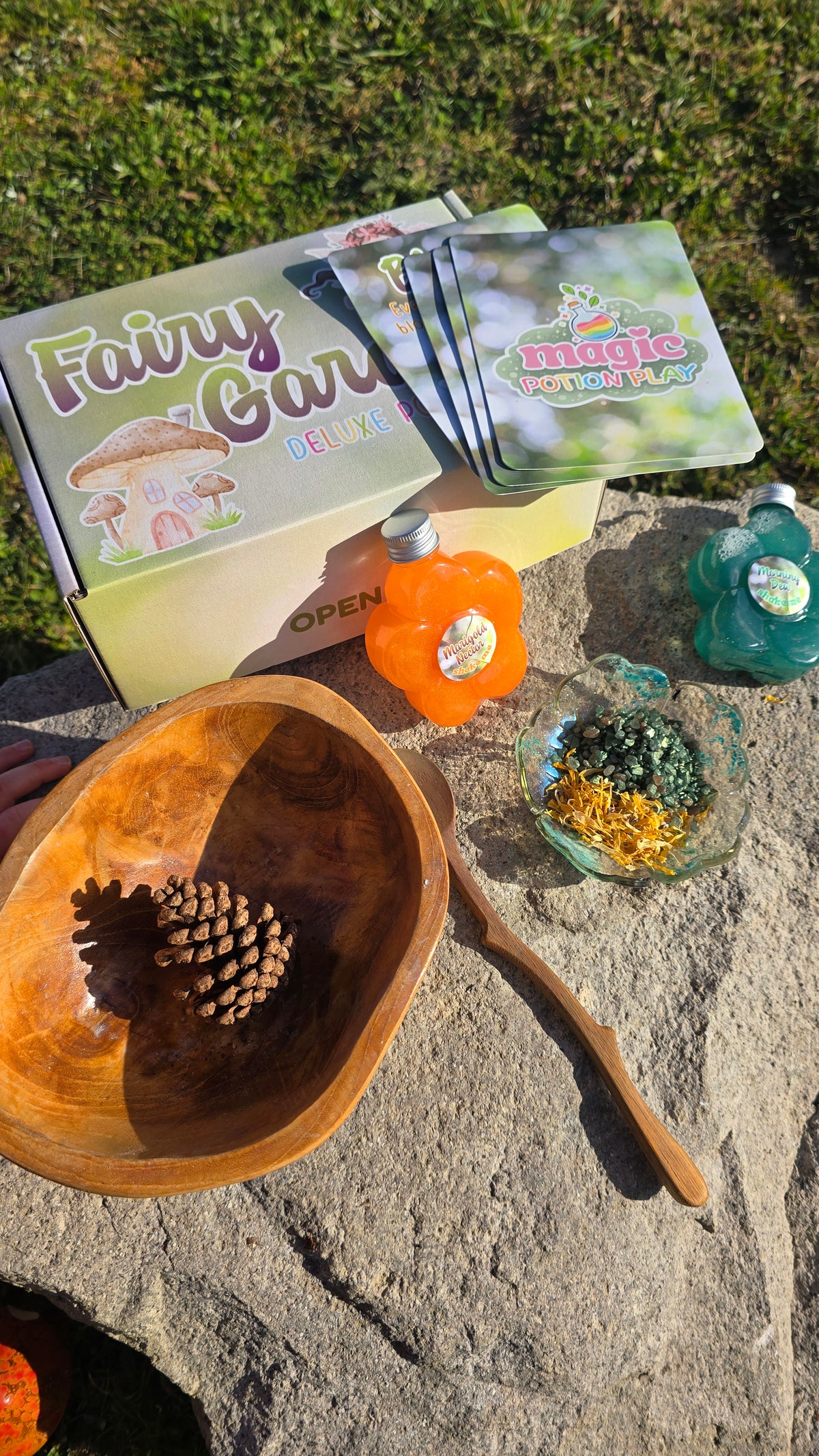 Deluxe potion kit with fairy garden bottles, orange potion scoop, and wood spoon