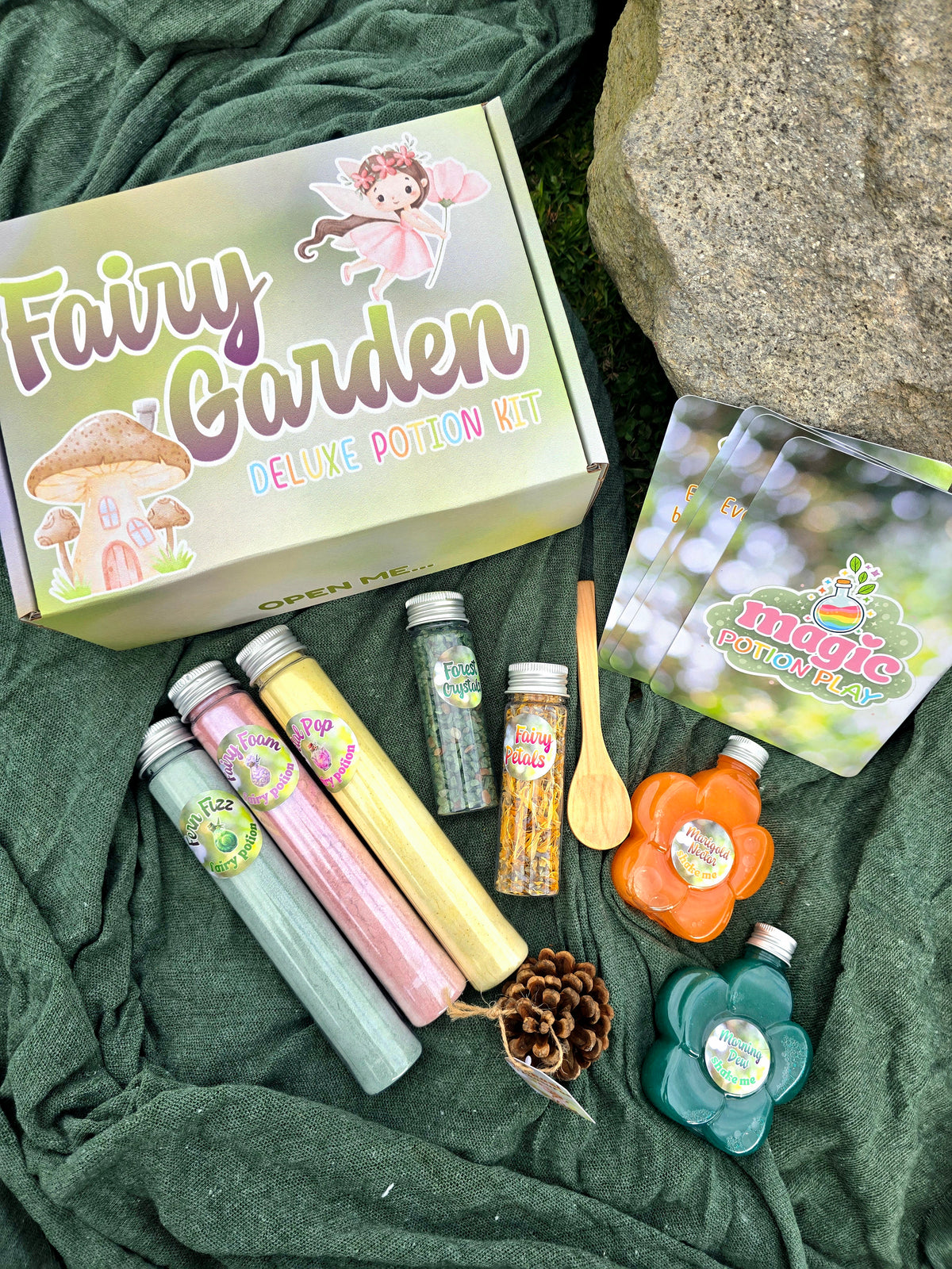 Fairy garden deluxe potion kit contents: bottles, heart jar lid, pinecones, scoops